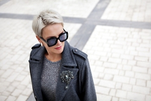 Glamorous older woman with a cropped blonde pixie cut